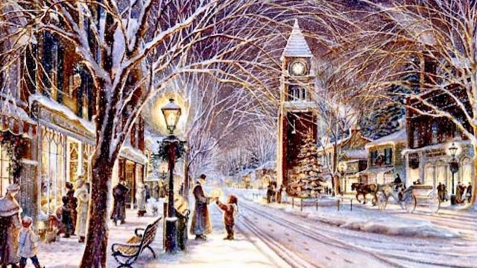 A charming, snow-covered village scene at night with people strolling and children playing. A tall clock tower stands in the background. The street is lined with glowing shop windows, bare trees, and a horse-drawn carriage. 124 on Queen Hotel and Spa | Hotel & Spa Niagara-on-the-lake | 1 (855) 988-4552